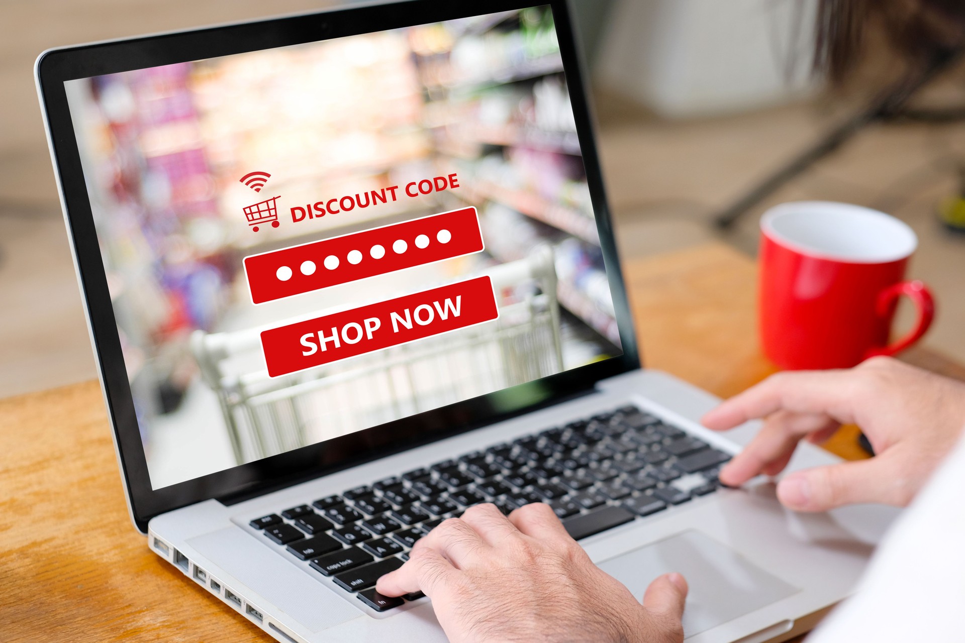 E-coupon, Grocery shopping online, Woman hand using laptop computer with discount coupon on screen, online shopping sale, digital marketing, retail business and technology, e commerce promotion concept